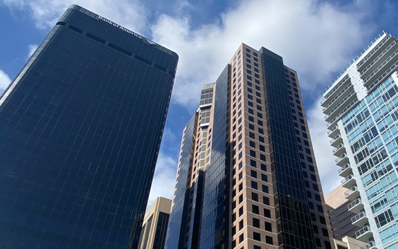 Upward view of three high-rise buildings in downtown San Diego